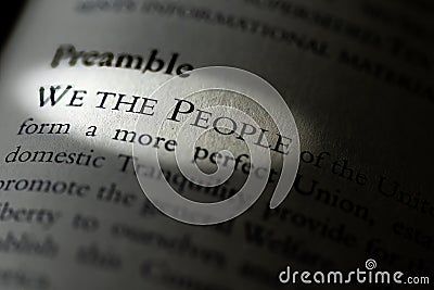 Closeup of the Preamble, We the People of the United States, printed and highlighted in textbook on white page. Stock Photo