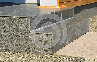 Closeup Problem Area on Entrance Stone Tiled Staircase with Stucco Stock Photo