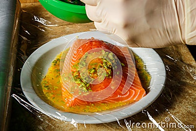 closeup process of marinating raw salmon fillet Stock Photo