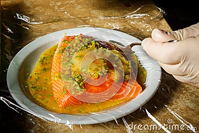 closeup process of marinating raw salmon fillet Stock Photo