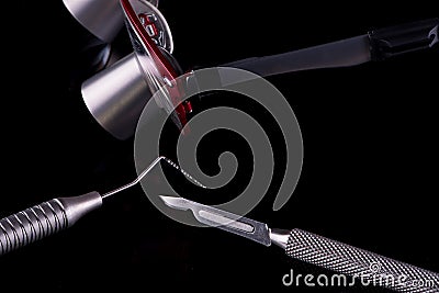 Closeup of professional dental tools. Periodontal probe, scalpel and magnifying glasses Stock Photo