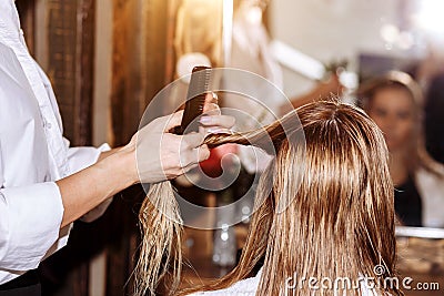 Beautiful blonde attractive woman at hairdresser Stock Photo