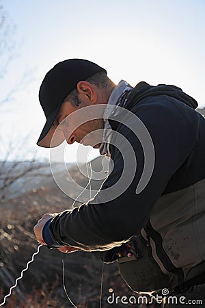 Fisherman preparing line Stock Photo