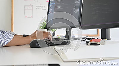Closeup programmer working with his computer. Stock Photo