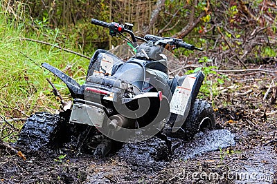 Closeup of a quad stuck in mud Stock Photo