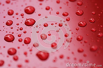 Closeup rain drops on red car with hydrophobic coating Stock Photo
