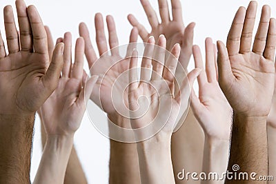 Closeup Of Raised Multiethnic Hands Stock Photo