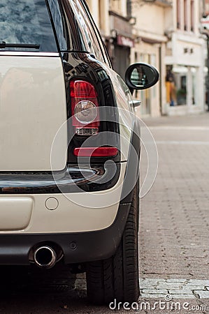 Closeup of rear light on beige mini cooper parked in the street Editorial Stock Photo