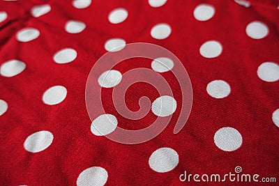 Closeup of red fabric with polka dot pattern Stock Photo