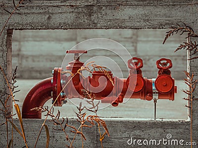 Closeup of a red fire hydrant with multiple valves Stock Photo