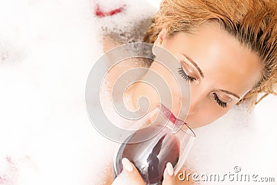Closeup of Relaxing Sensual Caucasian Blond Female in Foamy Bath Stock Photo