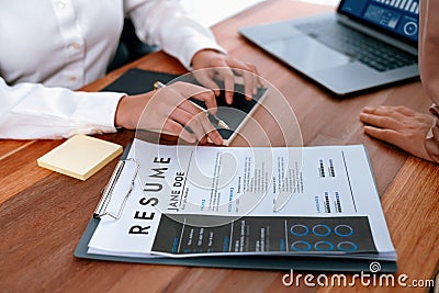 Closeup resume paper with qualifications on desk during interview. Enthusiastic Stock Photo