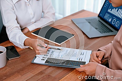 Closeup resume paper with qualifications on desk during interview. Enthusiastic Stock Photo