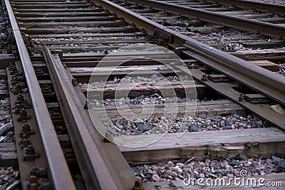 Closeup of an retro style railway track with wooden sleepers Stock Photo