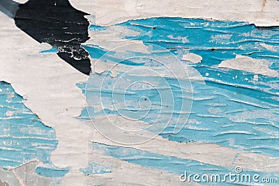 Closeup of ripped street poster background, blue torn street poster texture Stock Photo