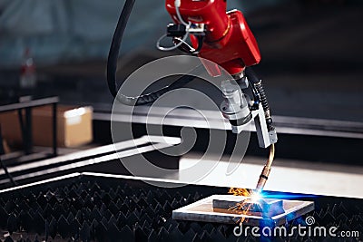 Closeup robot arm metal Argon Welding Machine working. Robotic technology in precious automation and manufacturing industry Stock Photo