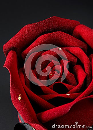 Closup of rose flower shaped cake on dark background Stock Photo