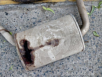 Rusted broken muffler of car silencer Stock Photo