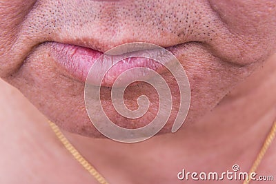 Closeup on saggy cheek skin of matured Asian man Stock Photo