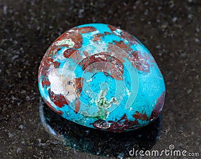 tumbled Chrysocolla with Cuprite rock on black Stock Photo