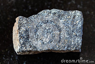 unpolished Zinc ore (Sphalerite) rock on black Stock Photo