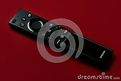 Closeup of Samsung smart TV remote control with buttons to access Amazon Prime and Netflix Editorial Stock Photo