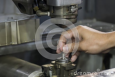 Closeup scene the operator setup the wire EDM machine Stock Photo