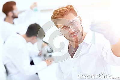 Closeup. scientist with beaker Stock Photo