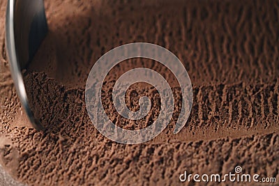Closeup scooping chocolate ice cream with spoon Stock Photo