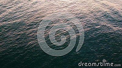 Closeup sea rippling surface reflecting morning sun. Turquoise water lapping Stock Photo