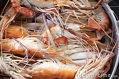 Closeup Seafood platter lunch in Thailand Summer vacation overhead shot. Cooked crab prawns on ice and wooden background. Tasty Stock Photo