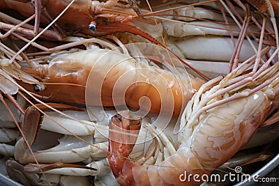 Closeup Seafood platter lunch in Thailand Summer vacation overhead shot. Cooked crab prawns on ice and wooden background. Tasty Stock Photo