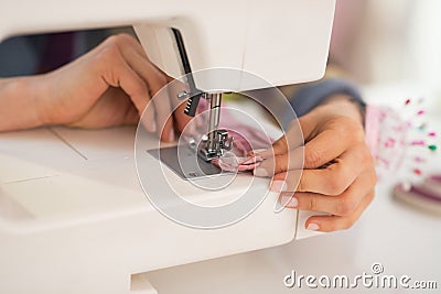 Closeup on seamstress sewing in studio Stock Photo