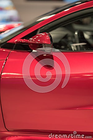 Closeup section of a new modern red colored car Stock Photo