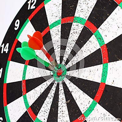 Closeup. several Arrows dart hitting the center of the target d Stock Photo