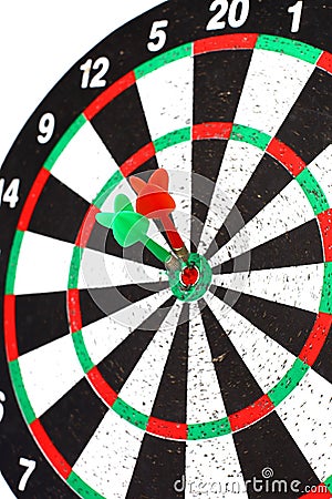 Closeup. several Arrows dart hitting the center of the target d Stock Photo