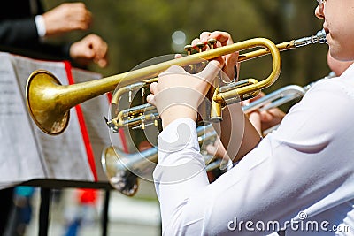A closeup of several trumpeters playing in a brass band Editorial Stock Photo