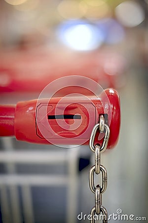 Closeup of a shopping trolley locking system. Stock Photo