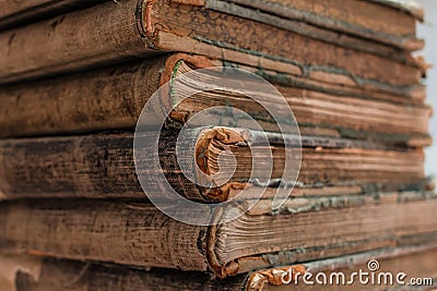 Closeup shot of ancient old books in a pile - vintage concept Stock Photo