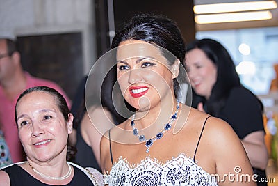 Closeup shot of Anna Netrebko in the hallway with fans after her concert in Madrid, Spain Editorial Stock Photo