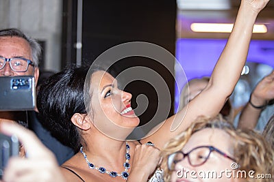 Closeup shot of Anna Netrebko in the hallway with fans after her concert in Madrid, Spain Editorial Stock Photo