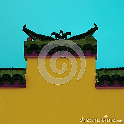 Closeup shot of a beautiful architectural detail of a colorful building against a blue sky Stock Photo