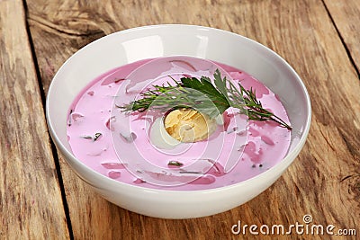 Closeup shot of a bowl of cold soup with beets, eggs and kefir Stock Photo