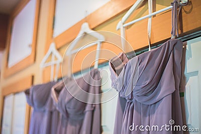 Closeup shot of bridesmaids dresses hanging up Stock Photo