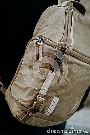 Closeup shot of brown camera utility bag with zippers, straps and backpack buckle Stock Photo