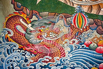 Closeup shot of a Buddhist painting with mural dragons Stock Photo