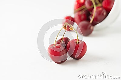 Closeup shot of a bunch of sweet cherries isolated on a white background Stock Photo