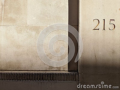 Closeup shot of 215 carved into a sandstone building Stock Photo