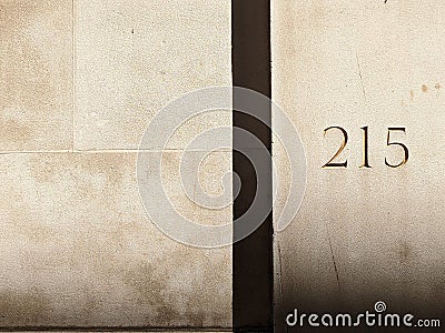 Closeup shot of 215 carved into a sandstone building Stock Photo