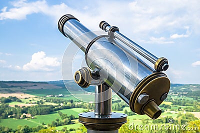 Closeup shot of a city telescope on a scenic natural background Stock Photo